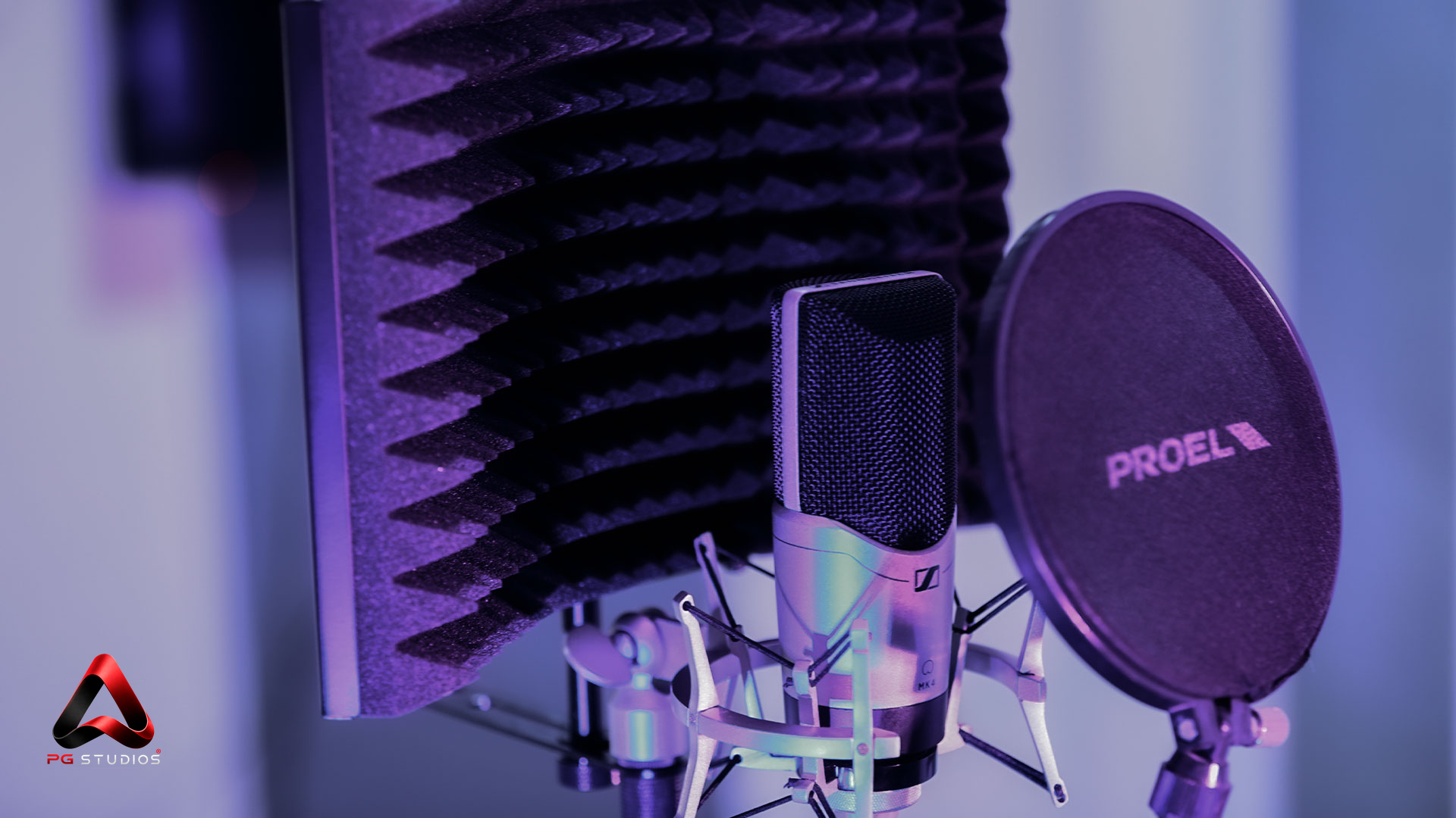 Microphone and pop filter in a PG Studios recording booth