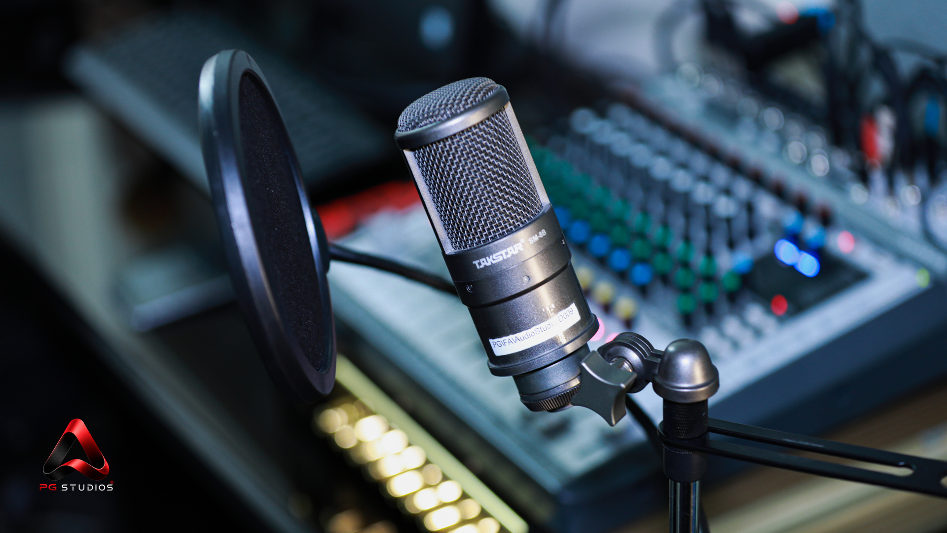 Recording microphone and mixing console at PG Studios