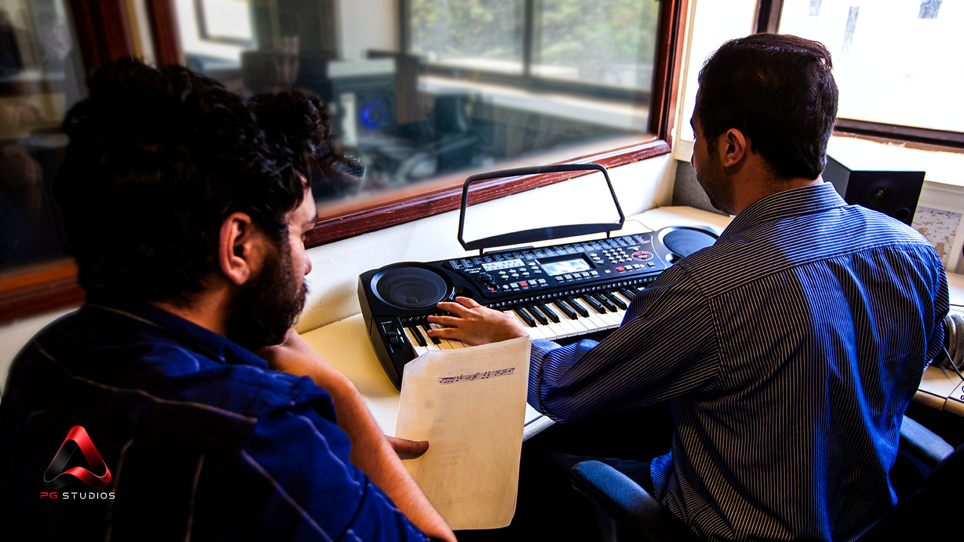 Audio team working in the PG Studios control room
